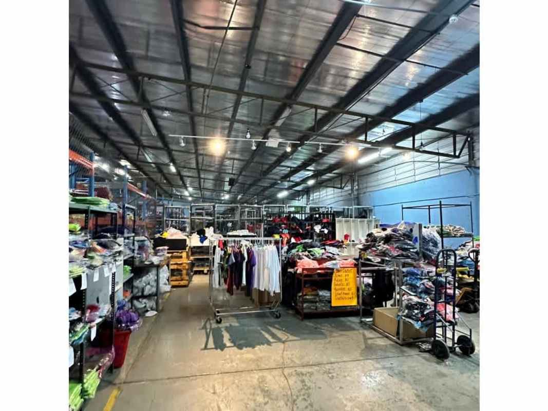 Modern office area with windows and wooden flooring inside warehouse Panama