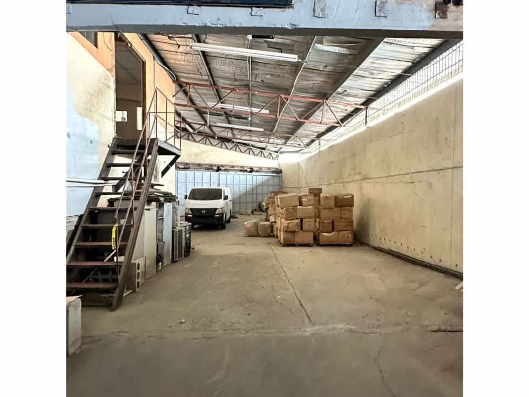Warehouse storage with metal racks and cardboard boxes in industrial area Panama City