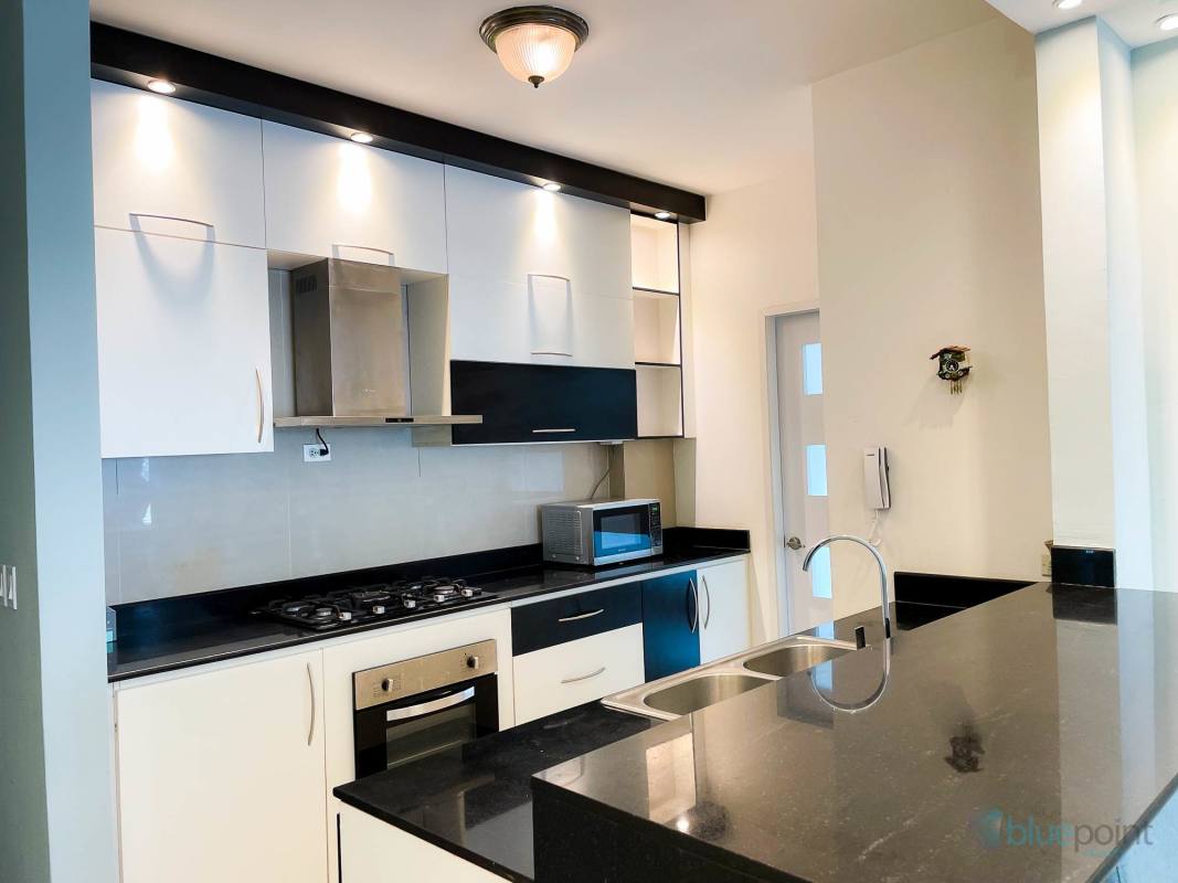 Renovated bathroom with tile walls and glass shower in PH Altos del Golf Panama