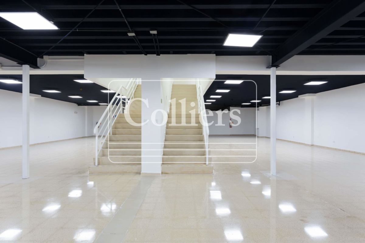 Spacious commercial basement or storage area with staircase inside Plaza Ágora Chanis