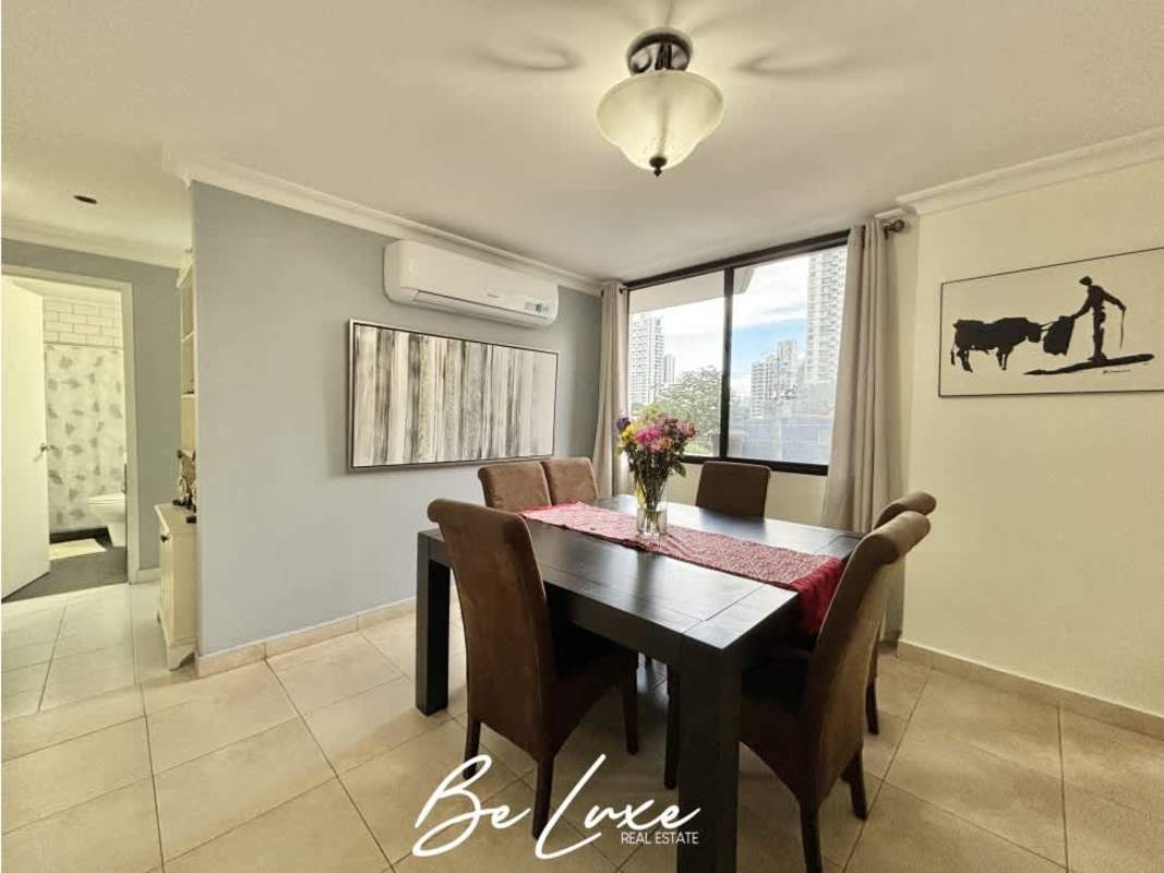 Dining area with large window city view in PH Pelican Bay Panama City