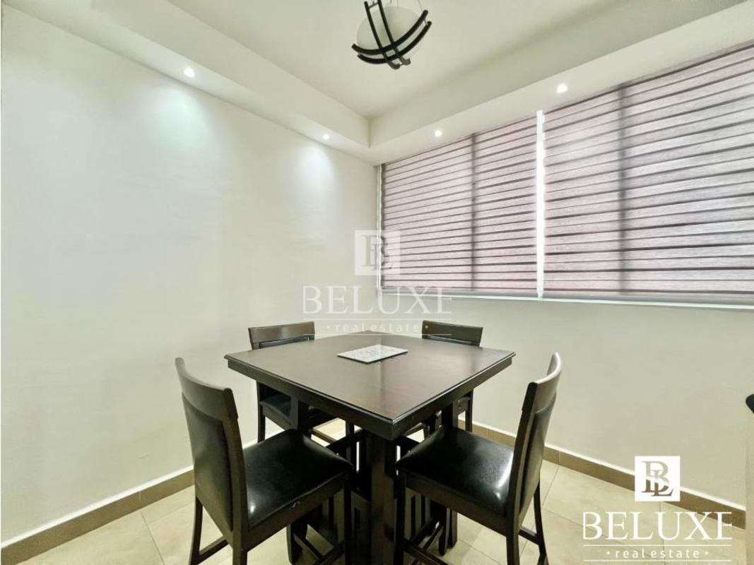 Kitchen with granite counters, stove, microwave in PH The One Tower Panama City