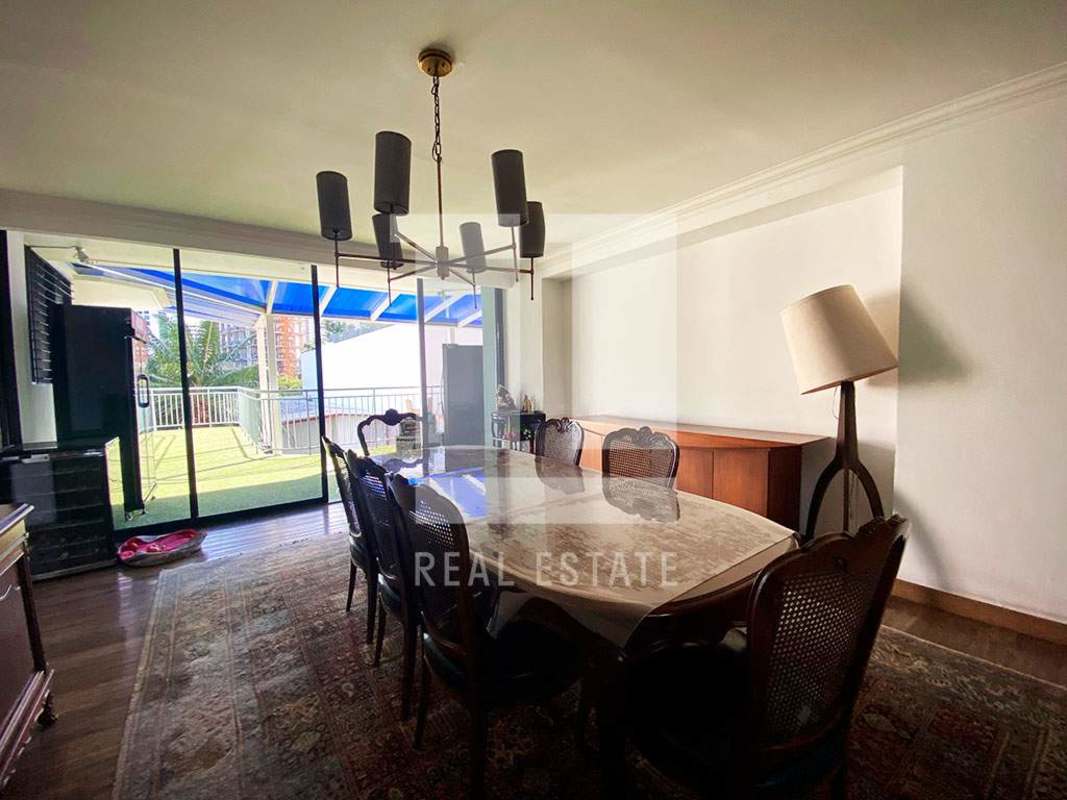 Elegant dining room with marble table and balcony views PH Coco Palace Panama