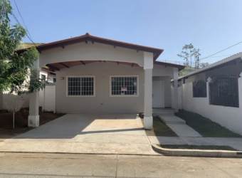 Large private backyard with green grass and PVC privacy fence in residential house Brisas del Golf Arraiján Panama