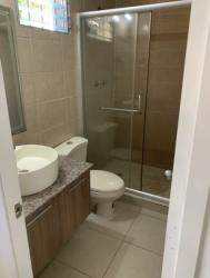 Bathroom with glass enclosed shower, vessel sink, and granite countertop in Brisas del Golf Arraiján Panama