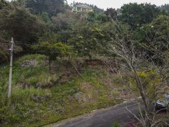 Aerial image of mountain plot with trees, road access in Siena sector Altos del María Panama