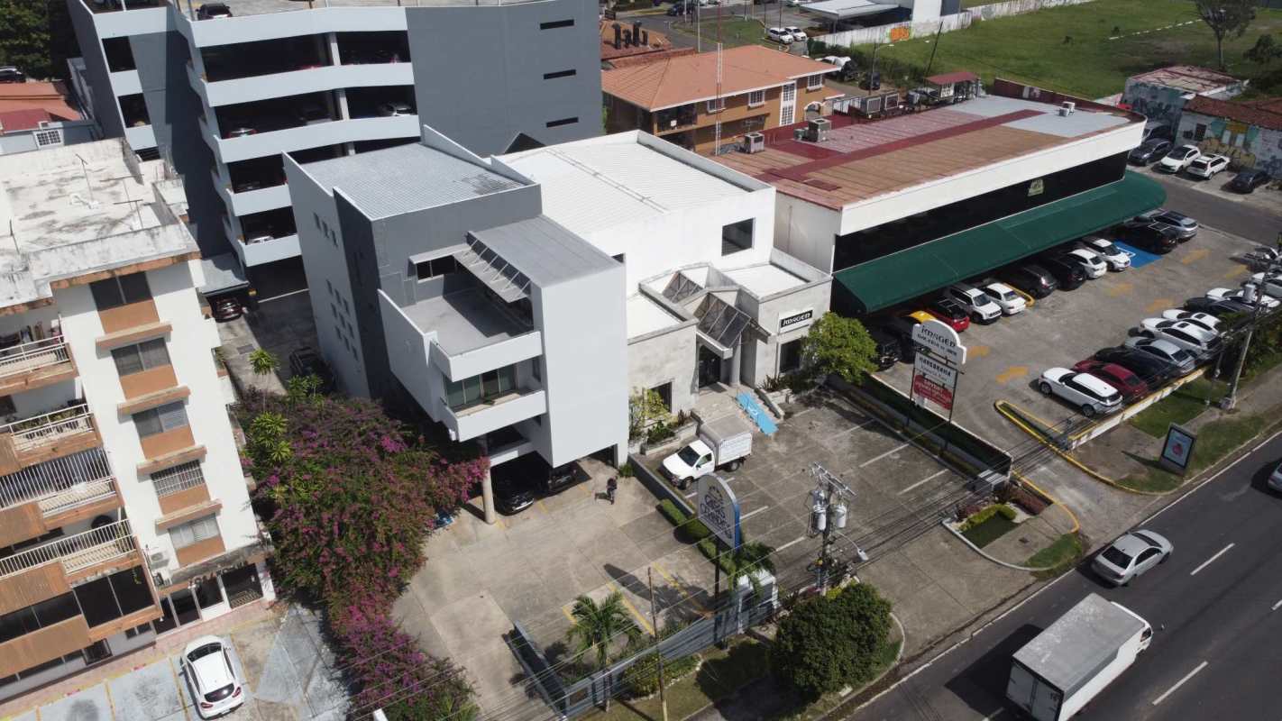 Aerial shot modern commercial building parking lot city street view San Francisco Panama