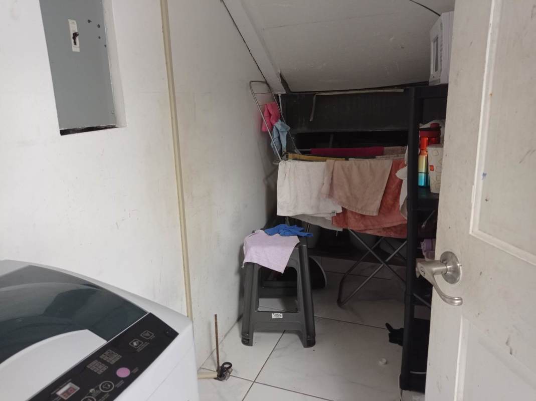 Small laundry and storage area with washer hook-up in Mega Mall commercial unit