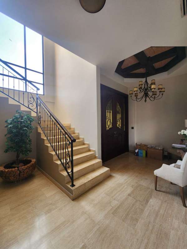 Gym with cardio and weights equipment, pool view windows inside luxury residence Clayton Panama