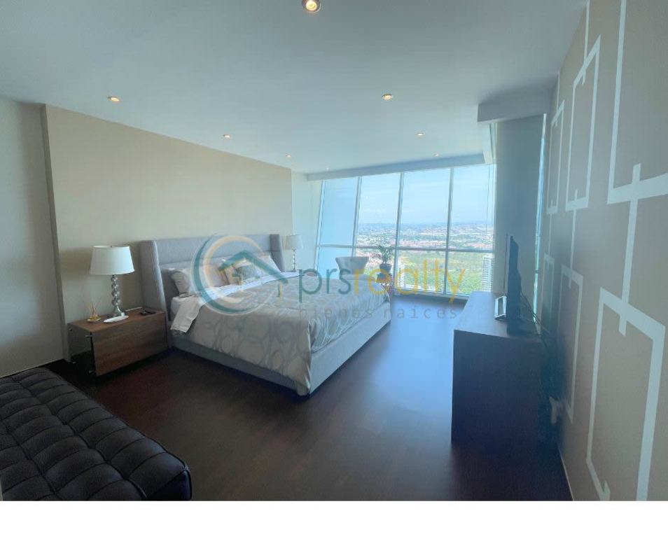 Spacious modern bathroom with double sinks, large glass shower enclosure, and contemporary design at PH Titanium Costa del Este