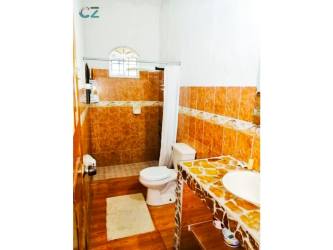 Rustic tiled bathroom walk-in shower Penonomé country estate Coclé Panama