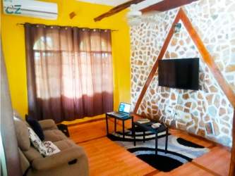 Rustic kitchen with skylight tiled floor open shelving Penonomé Coclé estate