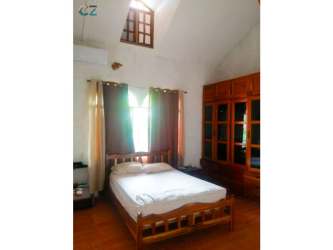 Covered carport metal gate tiled roof tropical garden Penonomé Panama