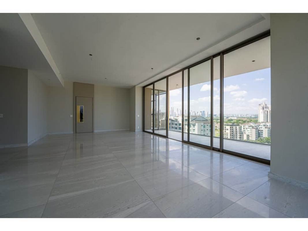 Infinity pool with lounge chairs and city views luxury condominium La Maison Fendi