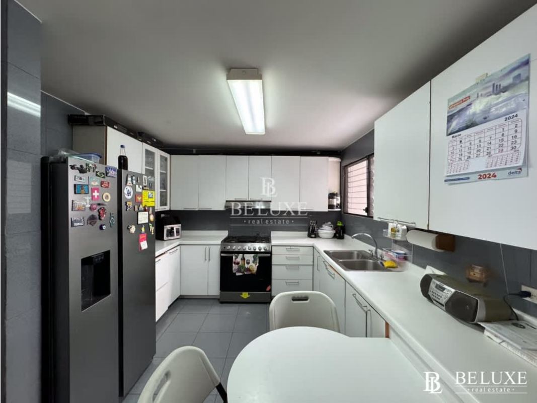 Large kitchen with cabinets and tile floor at PH Country Park San Francisco Panama