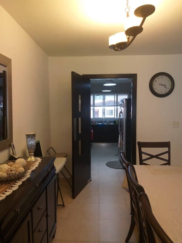 Dining room with ceramic floor near kitchen in duplex PH Villa Tiber Brisas del Golf