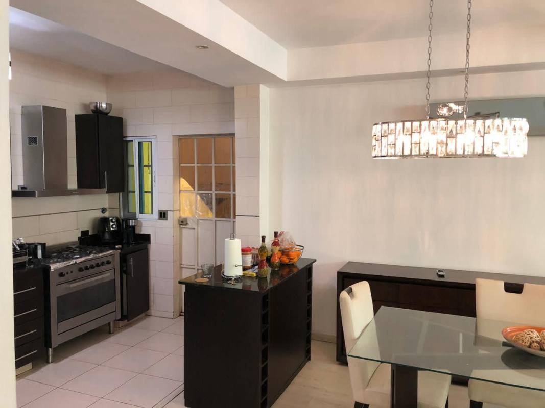 Bedroom with upholstered headboard, built-in wardrobe, AC unit Panama City Limajo house