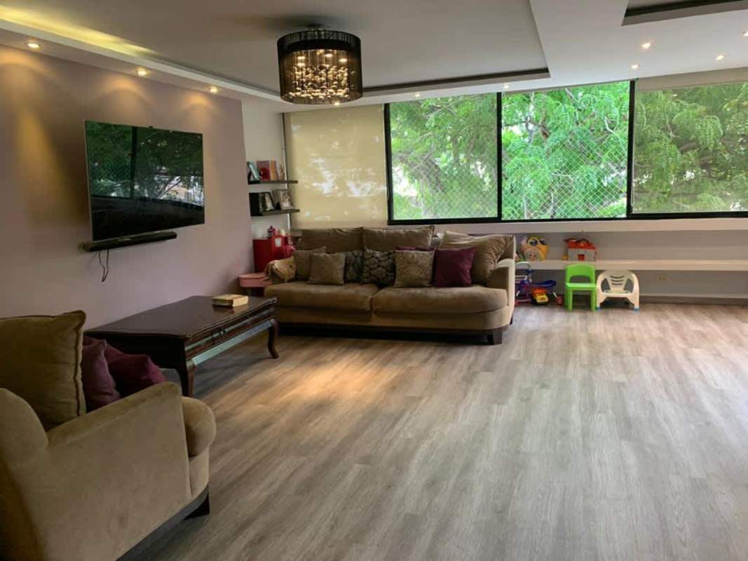 Contemporary living room with large windows and hardwood floors Punta Paitilla Panama