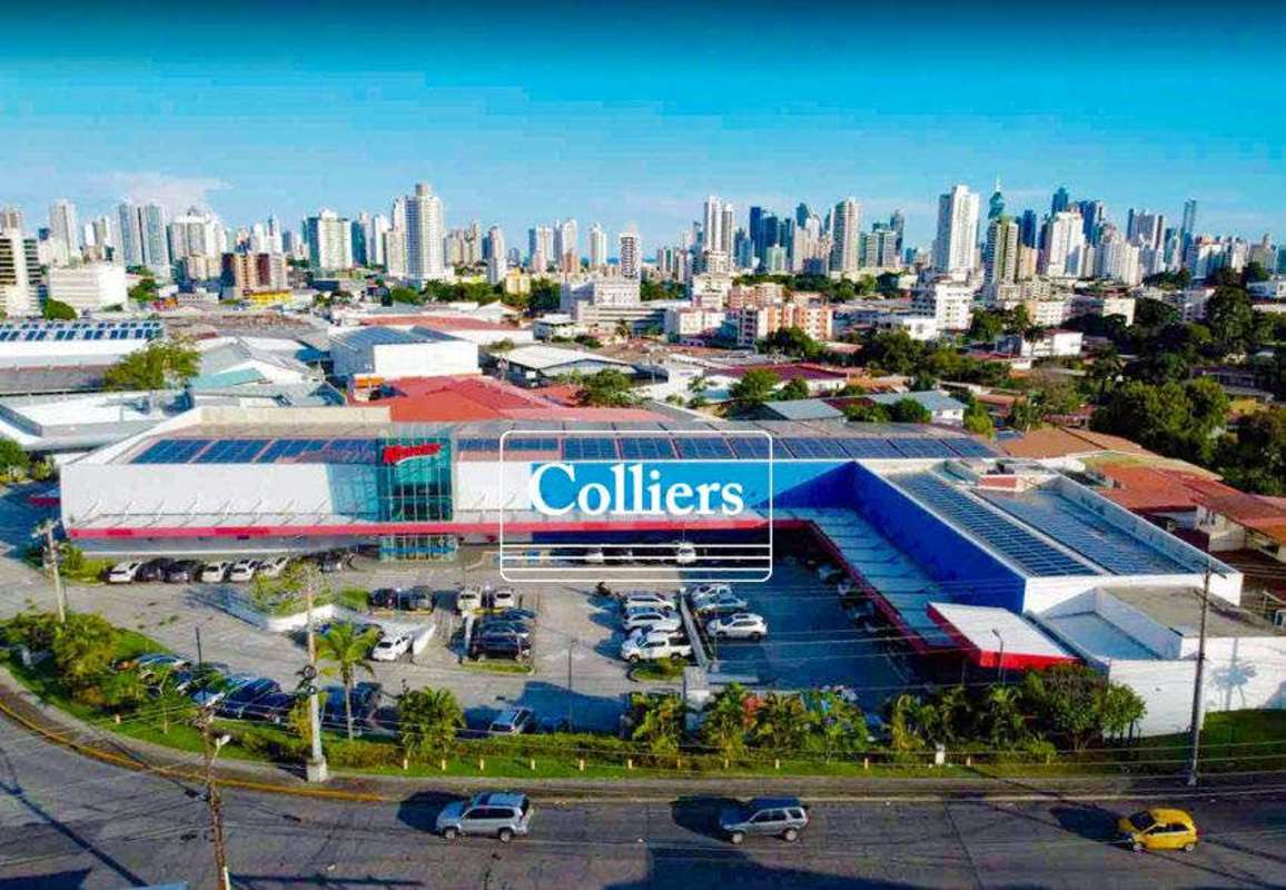 Bird’s eye view Plaza Novey commercial center with parking and solar panels on rooftop Panama City