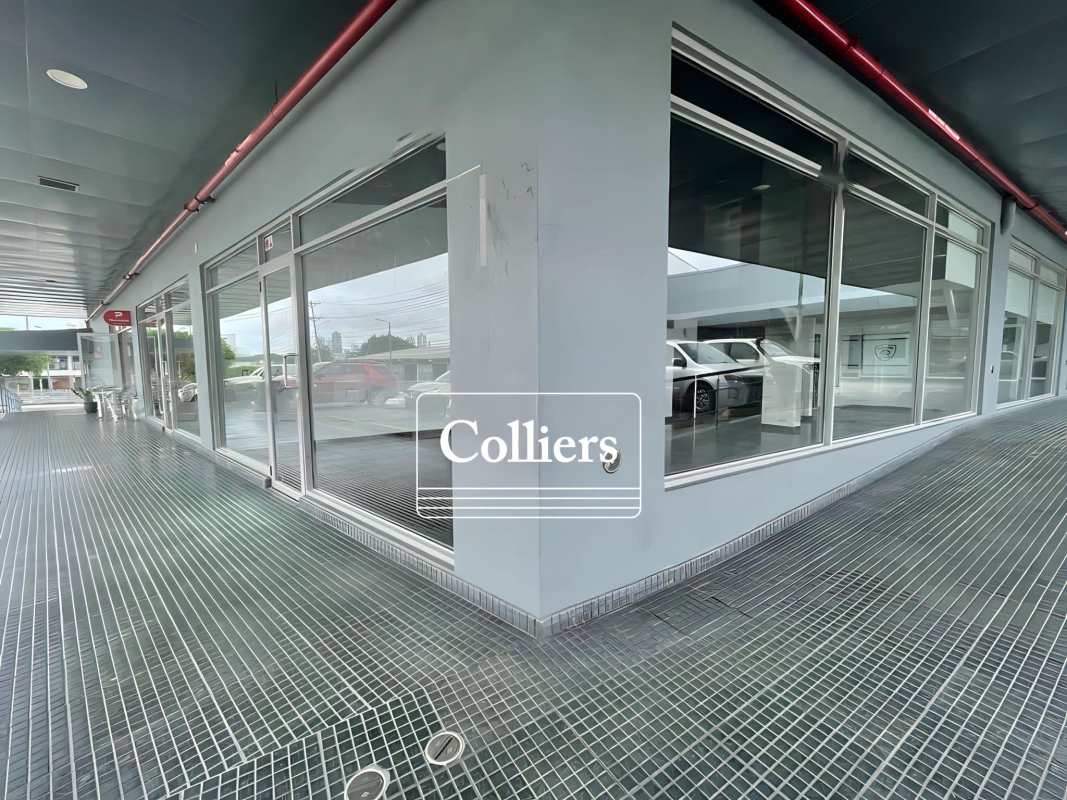 Corner view modern retail property with glass windows covered walkway Plaza Novey Los Angeles Panama