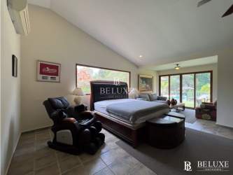 Spacious master bedroom with garden view in Coronado Country Club house Panama