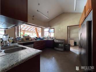 Modern kitchen with granite counters Coronado Country Club home Panama