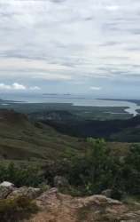 Elevated view from mountains overlooking forests and sea Panama West
