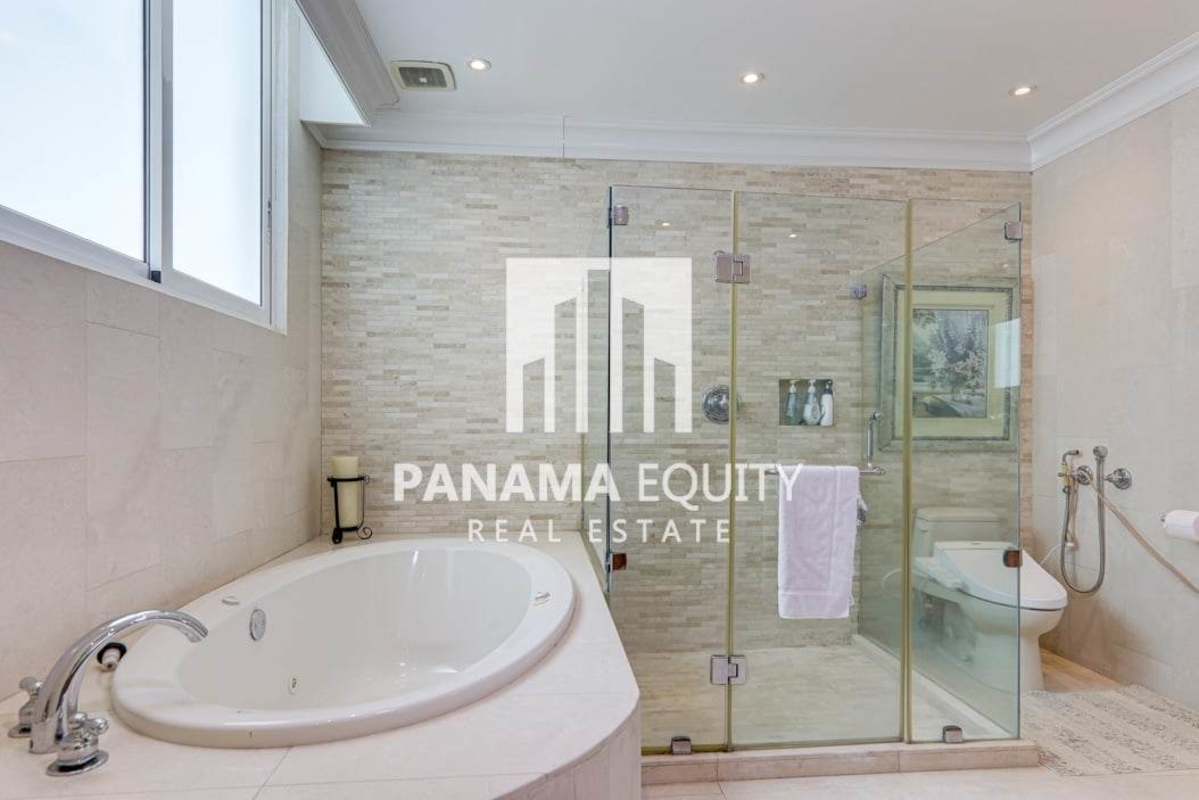 Elegant living room with floor-to-ceiling windows and Pacific Ocean views at Bahia Pacifica Punta Pacifica