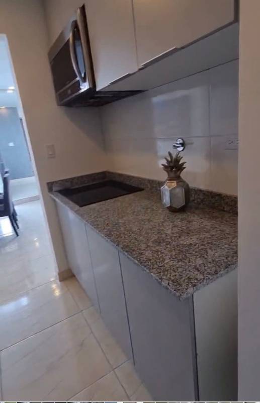 Compact kitchen with granite countertop in studio Panama City PH The Sands