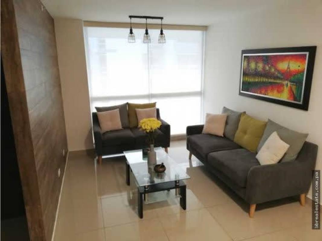 Bright living room with large window, balcony access, tile floors PH Coral Tower Panama