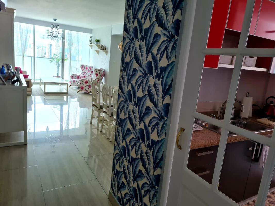 Modern kitchen with granite countertops and wooden cabinets PH Paitilla Tower Punta Paitilla