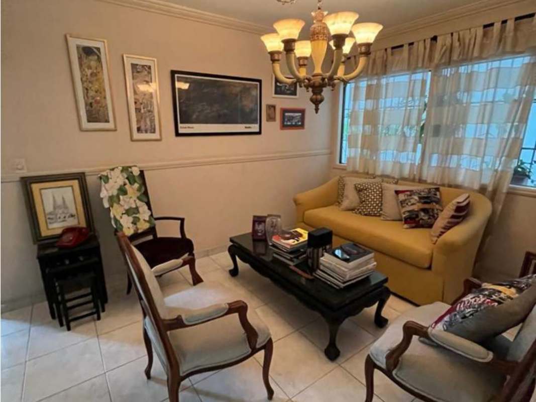 Cozy living space with chandelier, classic furniture, large windows PH Villa Gabriella San Francisco Panama