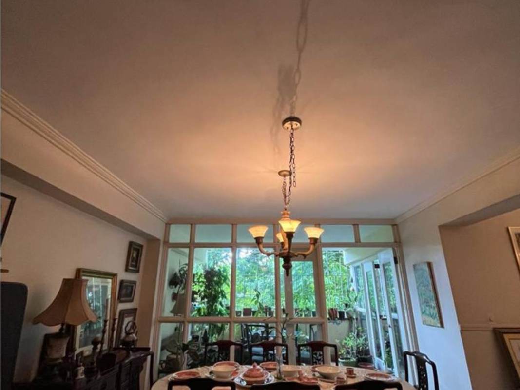 Closed kitchen with tile walls, gas stove and range hood in PH Villa Gabriella San Francisco Panama