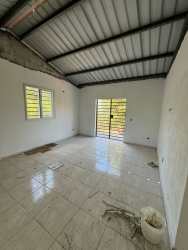 New fenced country house exterior in Manglarito Sora Panama mountain region