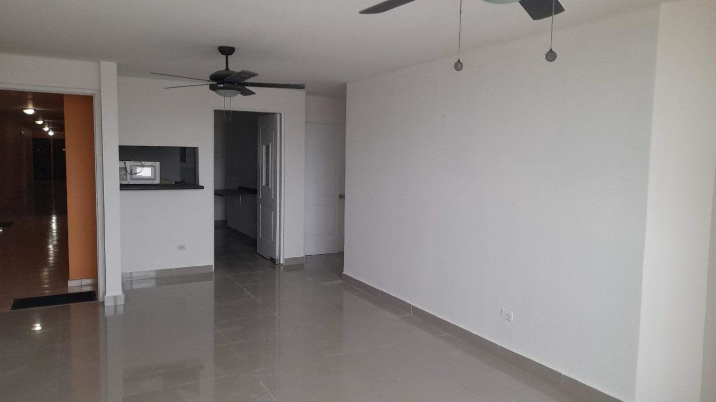 Dark cabinetry kitchenette with pass through window PH Park Place Parque Lefevre Panama
