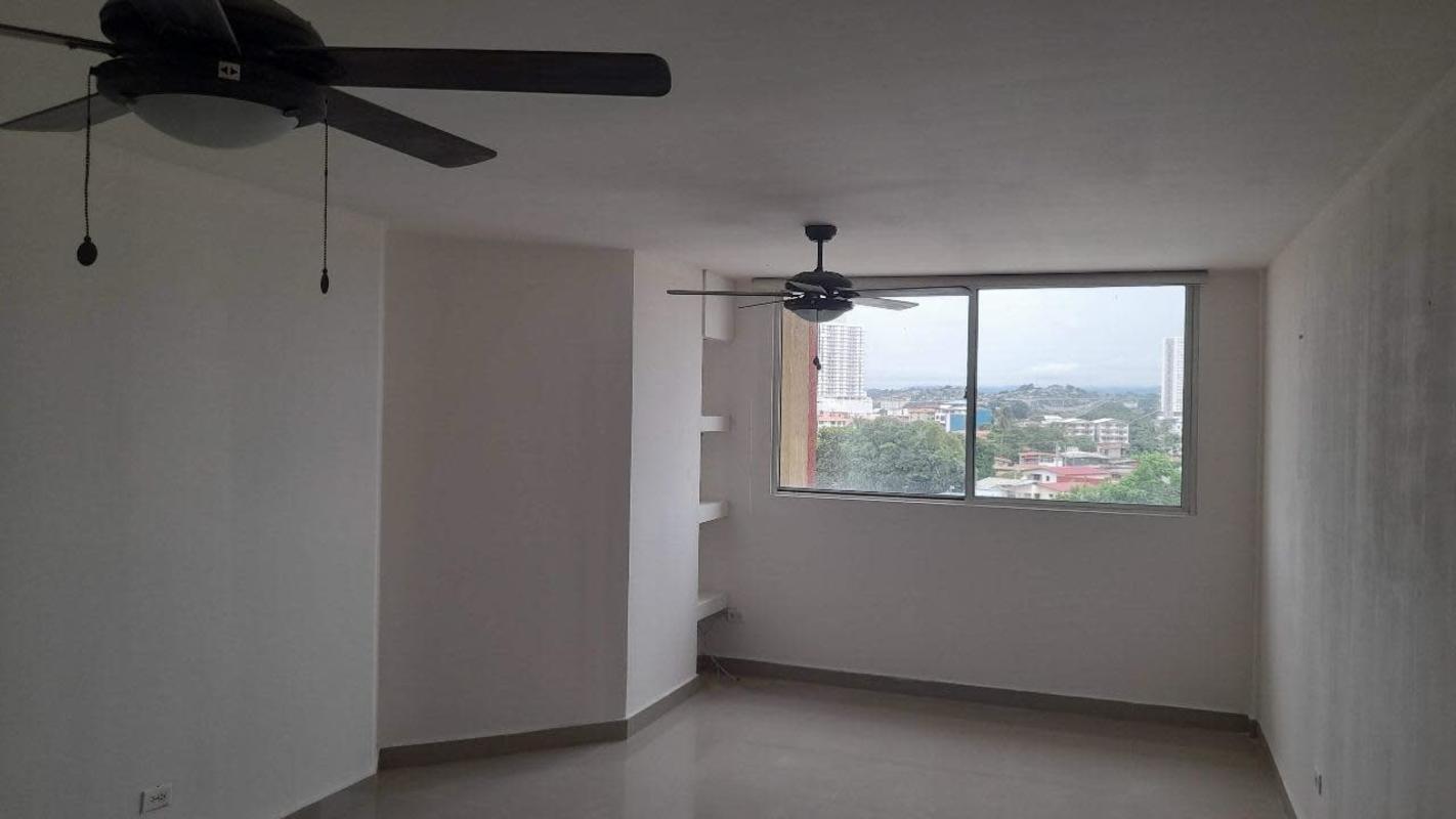 Small walk-in closet with shelf and hanging rod PH Park Place Parque Lefevre Panama