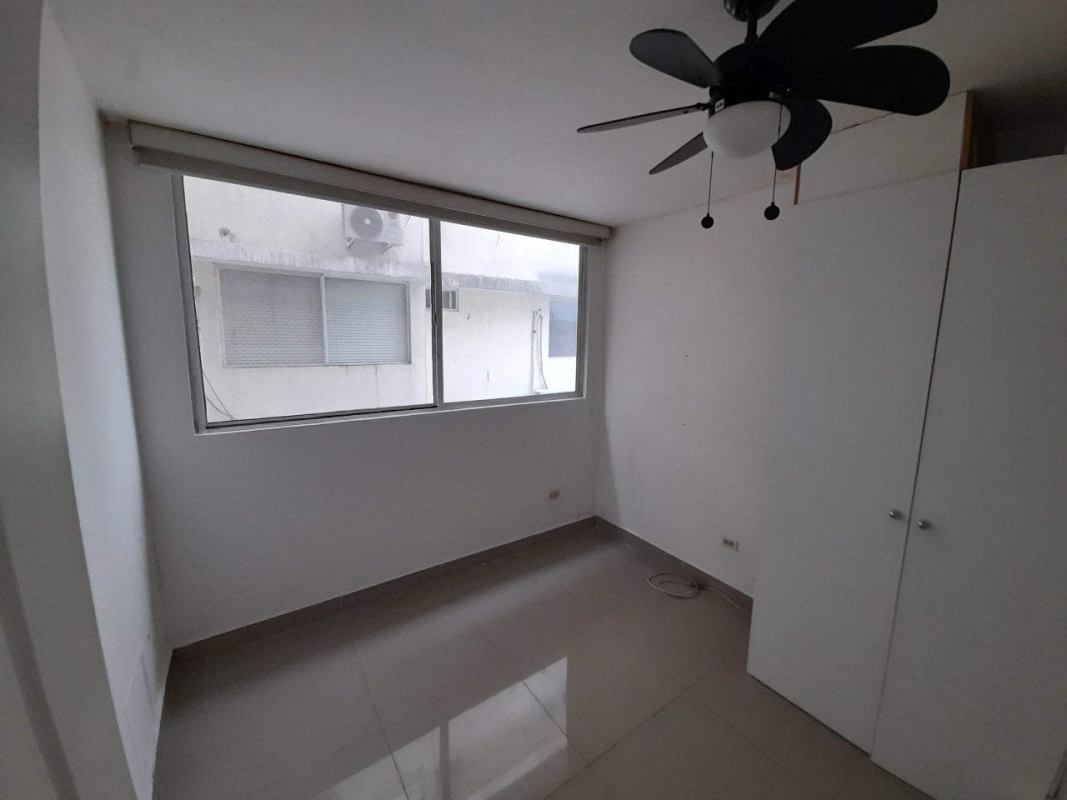 Bedroom with large corner windows, ceiling fan, tiled floor PH Park Place Parque Lefevre Panama