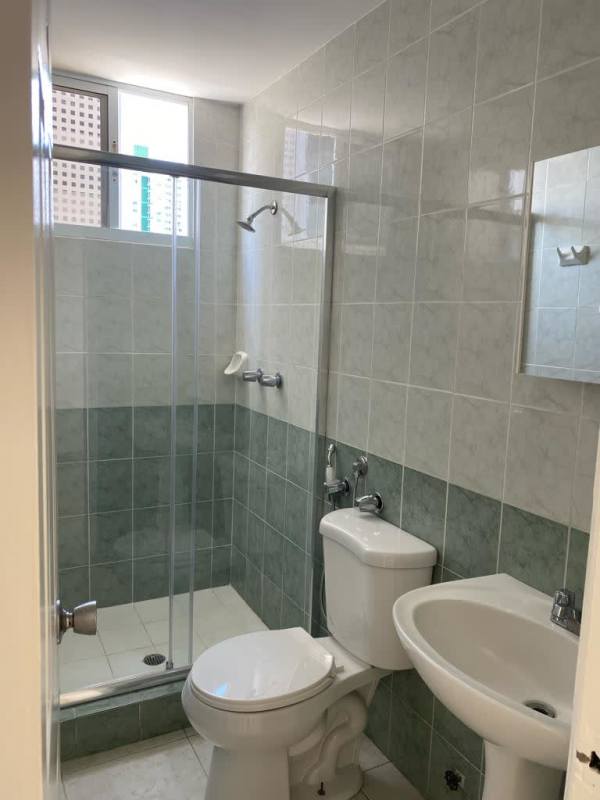 Bathroom with tiled walls, glass shower and modern fixtures in PH Hills Tower Panama