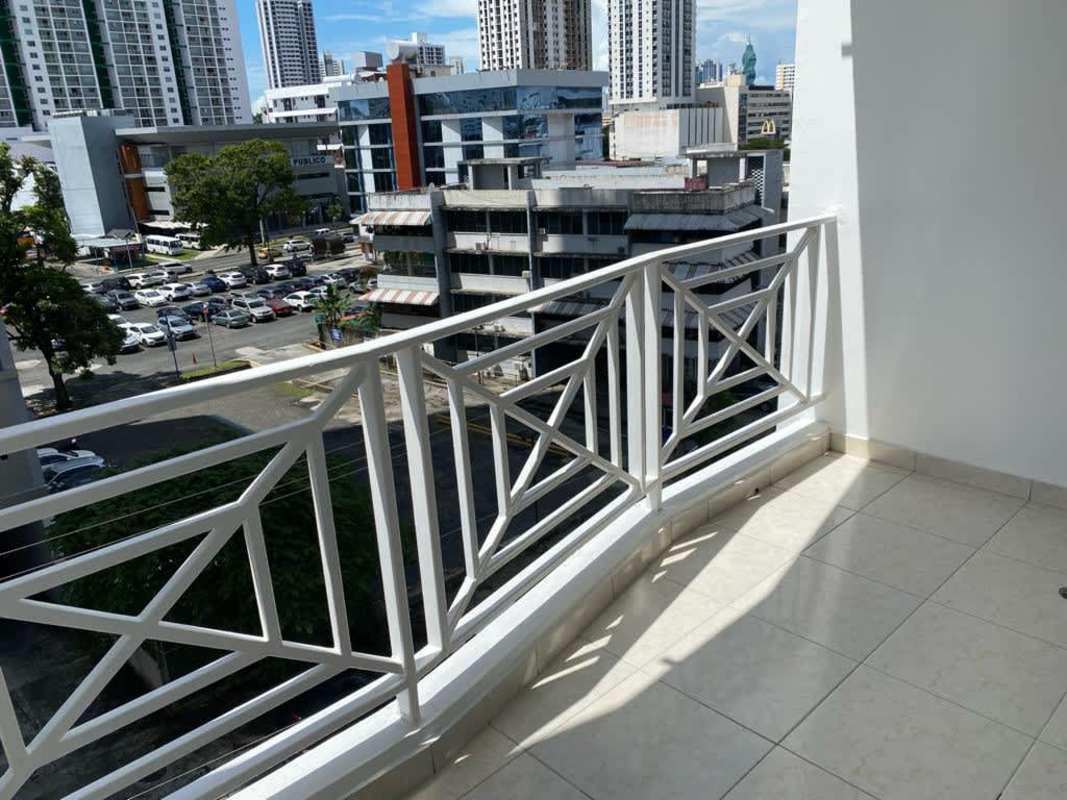 Modern balcony with railing and panoramic city view at PH Hills Tower Panama