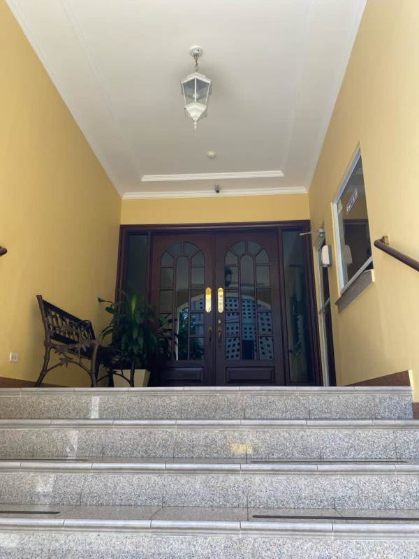 Bedroom with tile floors, ceiling fan, white walls at PH Hills Tower Panama