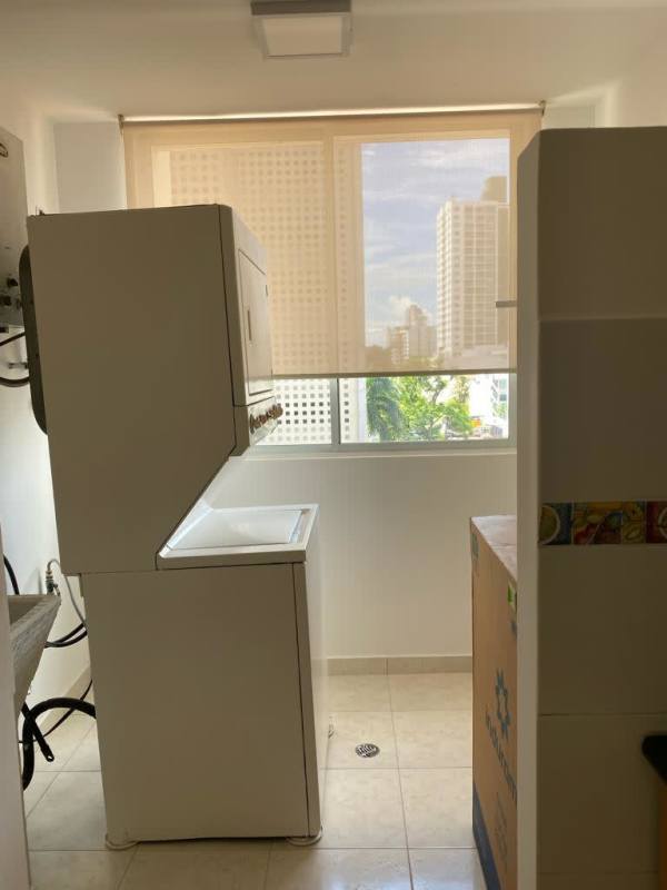 Spacious built-in white wardrobes in bedroom with modern finishes at PH Hills Tower Hato Pintado Panama
