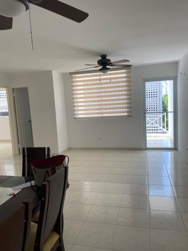 Contemporary bathroom with green tiles, glass shower and modern fixtures in PH Hills Tower Panama City