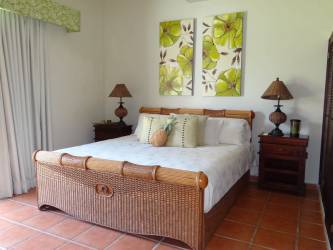 Circular outdoor pool with sun loungers surrounded by tropical landscaped garden Quinta Sol Panama