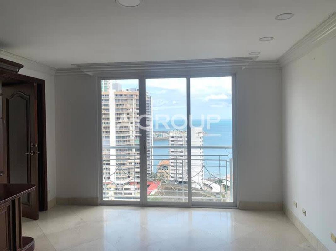 Spacious living room with floor to ceiling glass doors and ocean view at PH City Tower Punta Paitilla Panama
