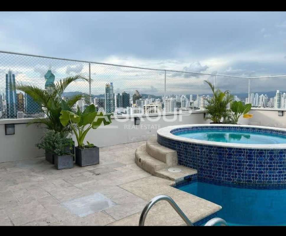 Rooftop infinity pool and jacuzzi overlooking Panama City skyline PH City Tower