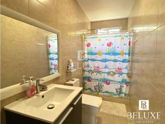 Living area with TV, bookshelf and kids play area in Ibiza Beach house Panama