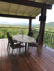 Rustic elegant dining room with scenic tropical garden views at Denter Tumas Villas Panama
