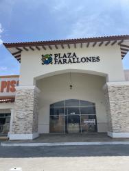 Grand entrance with archway and terracotta roof tiles at Plaza Farallones commercial center in Río Hato Panama