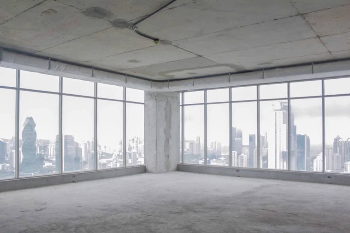 Raw unfinished premium office floor with floor-to-ceiling windows city view Panama