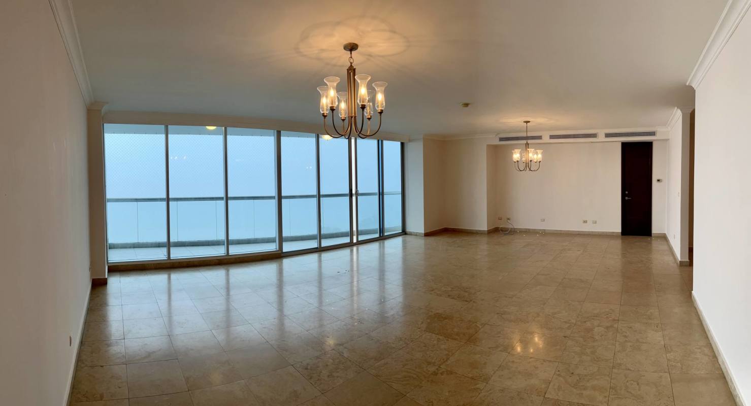 Wide entrance hallway with marble floors leading to bright living room with ocean view in PH Pearl at the Sea Costa del Este Panama